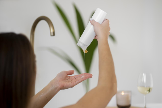 A lady is using a personal care product containing a rheology modifier. A lady is using a personal care product containing a rheology modifier.